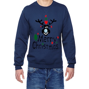 May include: A navy blue sweatshirt with a black reindeer illustration and the text "Merry Christmas" in black. The reindeer has a blue nose and is decorated with red and green hearts and stars.