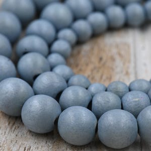 TWO STRANDS Winter Dusk Blue — Dyed Waxed Wood Beads in Soft Frosted Blue