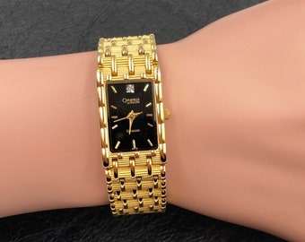 Vintage Caravelle Bulova oro rectangular cara reloj de pulsera