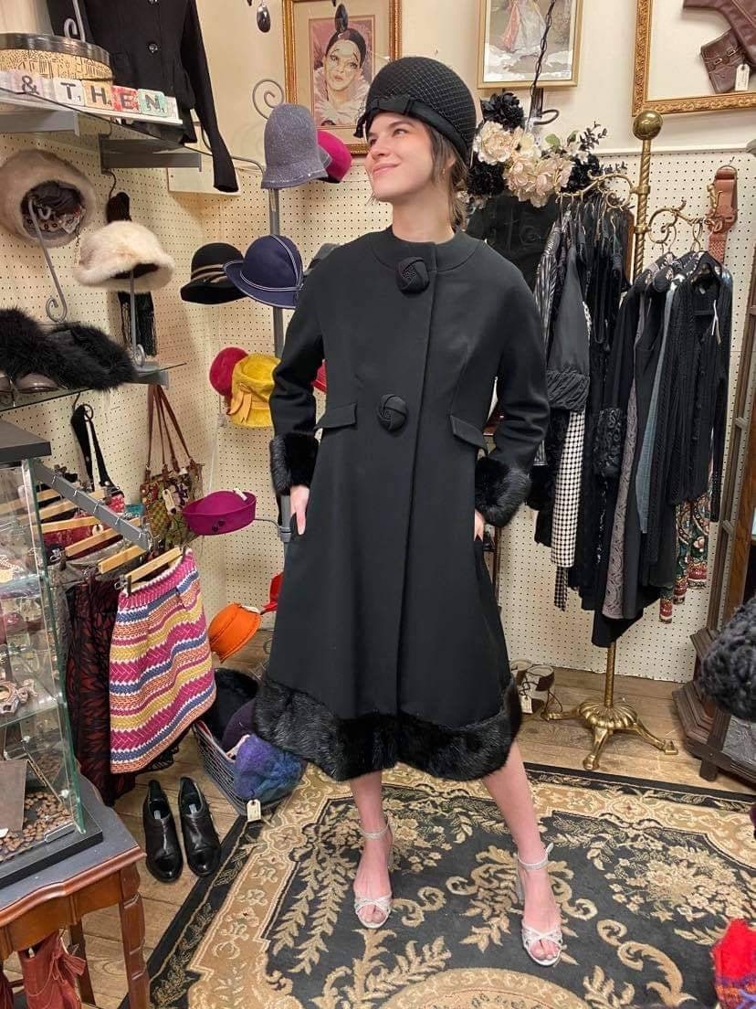 collarless black coat