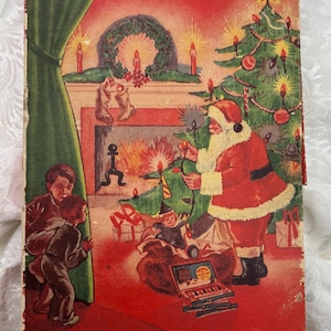 May include: Vintage Christmas Lights by NOMA box with a festive illustration. Santa Claus decorates a Christmas tree, while children watch. The box is red with green and yellow text, and the text "For a Safe and Brighter Christmas".