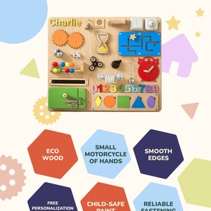 May include: A wooden activity board with various textures and activities for children. It features a clock, gears, a maze, a slider, a lock, a bell, a spinning wheel, and numbers. The board is personalized with the name "Charlie".