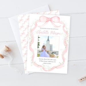 May include: Pink and white baptism invitation with a watercolor design of a bow and floral accents. The invitation includes the text "Please join us for the baptism of Charlotte Peterson" and details for the event.