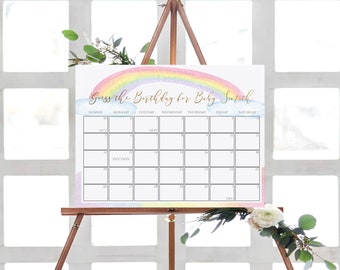 May include: A rainbow-themed printable calendar for a baby shower game. The calendar is titled "Guess the Birthday for Baby Suzith" and has the months October, November, and December listed. The due date is marked on the calendar.