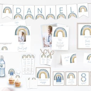 May include: A selection of baptism party decorations with a watercolour rainbow design in blue, yellow, and green. Includes a banner spelling "DANIEL", invitations, thank you cards, cupcake toppers, water bottle labels, and framed signs.