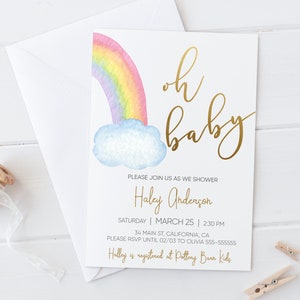 May include: A baby shower invitation with a watercolor rainbow and cloud design. The text "oh baby" is written in gold script. The invitation includes the name "Haley Anderson", the date "March 25", and the time "2:30 PM".