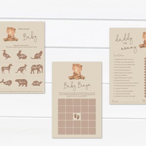 May include: Three printable baby shower game cards featuring a brown bear illustration. The first card is a "Who is My Baby?" game with animal silhouettes. The second card is a "Baby Bingo" game with a 5x5 grid. The third card is a "Daddy or Mommy" game with questions and answers.