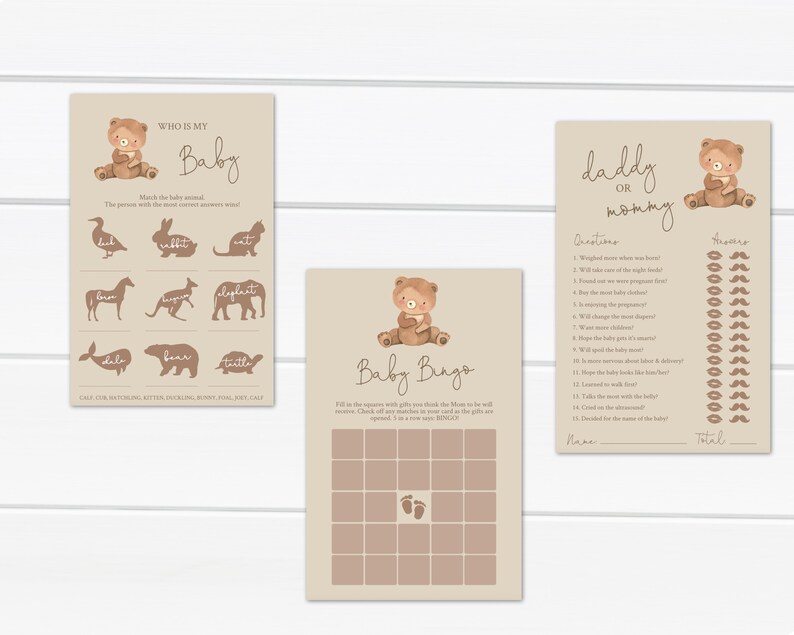 May include: Three printable baby shower game cards featuring a brown bear illustration. The first card is a "Who is My Baby?" game with animal silhouettes. The second card is a "Baby Bingo" game with a 5x5 grid. The third card is a "Daddy or Mommy" game with questions and answers.