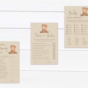 May include: Three printable baby shower game cards featuring a brown bear illustration. The first card is a "Who Knows Mommy Best?" game with questions about the mother-to-be. The second card is an "Over or Under" game with questions about pregnancy and childbirth. The third card is a "Baby Around the World" game where players match the word for "baby" in different languages.