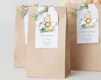 May include: Brown paper gift bags with a safari animal themed tag that says "Thanks for coming to Emily's Baby Shower 02.05.25"