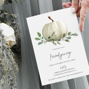 May include: A white pumpkin with green leaves on a white background. The text "PLEASE JOIN US FOR A friendsgiving FRIDAY, NOVEMBER 25TH 2025, 4:00PM hosted by AMBER & JOSEPH JOHNSON 123 Main Street, San Francisco, CA Please RSVP to Amber by Nov. 15th at myemail@gmail.com" is printed on the card.