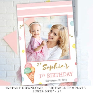 May include: Editable template for a 1st birthday photo booth backdrop with a pink and white striped background, a photo frame, and a colorful ice cream cone graphic. The text "Sophia's 1st Birthday September 12, 2018" is included.