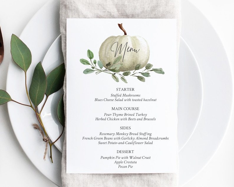 May include: A white pumpkin with green leaves and the word "Menu" written on it. The menu lists a Thanksgiving dinner with starter, main course, sides, and dessert options.