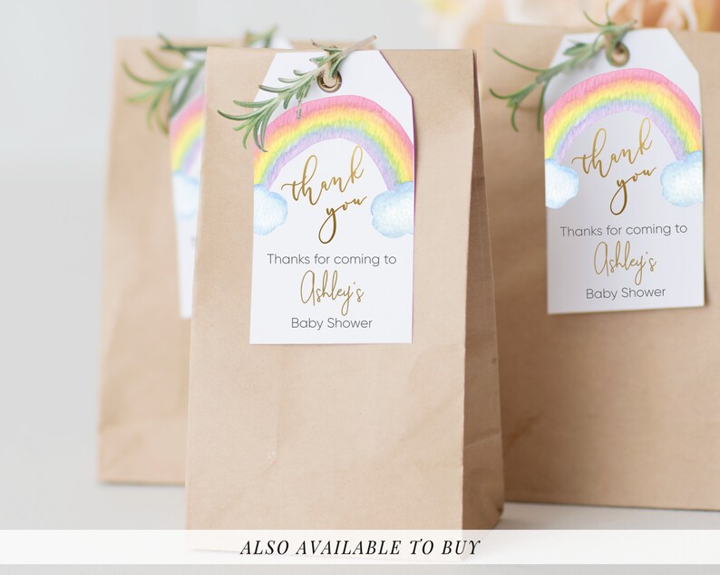 May include: Rainbow baby shower favor tags with the text "thank you" in gold script. The tags feature a watercolor rainbow with clouds and the text "Thanks for coming to Ashley's Baby Shower".