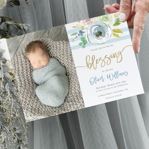 May include: A baby blessing invitation with a watercolor floral design in shades of blue and green. The invitation features a photo of a baby boy sleeping in a blue blanket. The text on the invitation reads "Please join us for the blessing of our son Oliver Williams Saturday, March 25th, 2022 at two o'clock in the afternoon 54 Main Street, California, CA Lunch to follow"