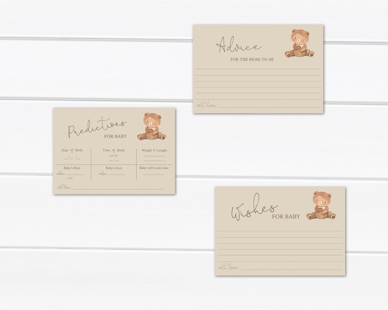 May include: Three printable cards with a brown bear illustration. The cards are beige with brown lines and text. The text on the cards reads "Predictions for Baby", "Advice for the Mom-to-Be", and "Wishes for Baby".