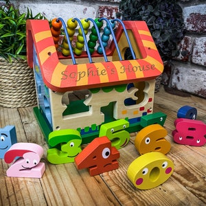 Personalised Jumini Wooden Activity House - Laser engraved with child&#39;s name - Suitable for ages 1+ - helps build hand-eye co-ordination
