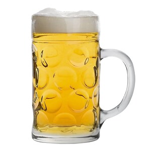 May include: A clear glass beer mug filled with golden beer and topped with a thick layer of white foam. The mug has a large handle and a textured, dimpled surface. The beer is a light amber color.