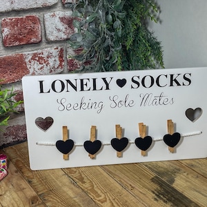 Beautiful "Lonely Socks" peg board for organising all your odd socks