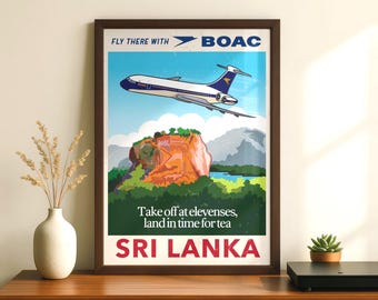 May include: A framed vintage-style travel poster for Sri Lanka featuring a BOAC airplane flying over a large orange rock formation and green landscape. The text reads: FLY THERE WITH BOAC, Take off at elevenses, land in time for tea, SRI LANKA.