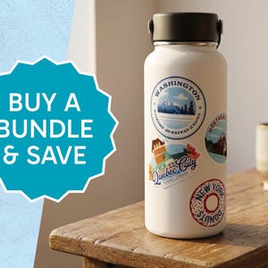 May include: A white insulated water bottle adorned with travel-themed stickers, including Washington, Montreal, Quebec City, and New York. The bottle sits on a wooden surface, with a mug and notepad in the background. The image also includes a teal graphic that says "BUY A BUNDLE & SAVE."