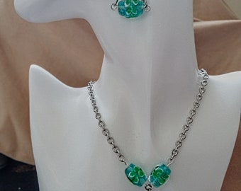 Necklace and earrings set. Aqua blue and green translucent art glass oval beads suspended from a heavy cable chain link.