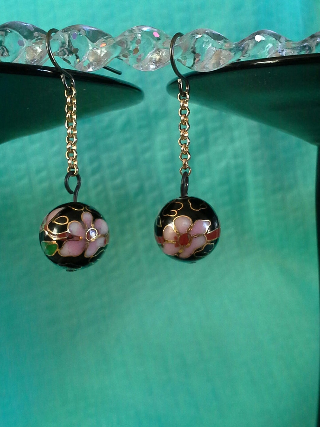 Black, Round, Cloisonne Bead With Pink, Green, Lavender and Gold Accent. Hung From Gold Accent