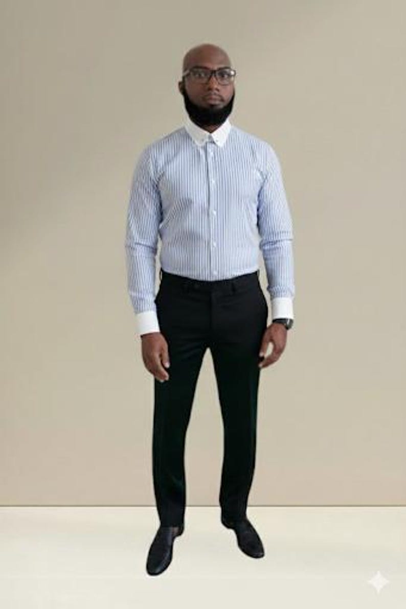 May include: A blue and white striped dress shirt with a white collar and cuffs, paired with black dress pants and black dress shoes. The shirt has long sleeves. The person is wearing glasses and a watch.