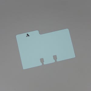 May include: A light blue file folder with three holes and the letter "A" printed on the front.