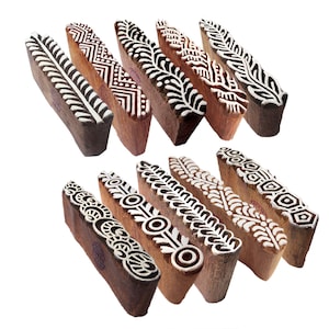 May include: A set of 12 wooden printing blocks with intricate designs. The blocks are made of natural wood and have a variety of patterns, including floral, geometric, and abstract designs. The blocks are perfect for creating unique and personalized prints on fabric, paper, and other surfaces.