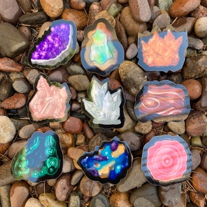 May include: Nine different crystal stickers with various colors and textures. The stickers feature amethyst, rose quartz, clear quartz, agate, opal, and more.