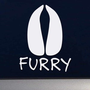 May include: White vinyl decal of a deer hoof print with the word "FURRY" written underneath in a handwritten style.