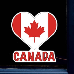 May include: A red heart-shaped sticker with the Canadian flag and the word "CANADA" underneath.