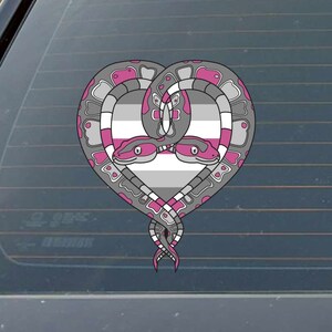 May include: Two snakes intertwined in a heart shape, with their heads facing each other. The snakes are gray with pink accents, and the heart is filled with the colors of the asexual pride flag.