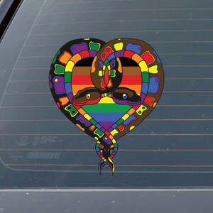 May include: Two snakes intertwined in a heart shape, with a rainbow color scheme. The snakes are brown, black, and purple, with red and blue accents. The heart is filled with a rainbow pattern.