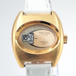 Video* Swiss 1970s "Hanowa" Jump Hour Digital Vintage Timepiece New Old Stock Gold Plated Case 1970's Fashions Unisex Watch White Strap