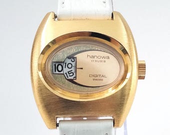Video* Swiss 1970s "Hanowa" Jump Hour Digital Vintage Timepiece New Old Stock Gold Plated Case 1970's Fashions Unisex Watch White Strap