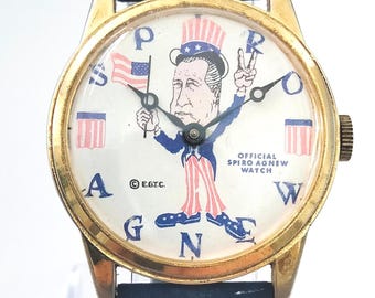 VIDEO* Raro reloj de pulsera político estadounidense "SPIRO AGNEW" de los años 60. Movimiento mecánico. Pieza de colección, ideal para promoción publicitaria, regalos de cumpleaños o como accesorio de rodaje.