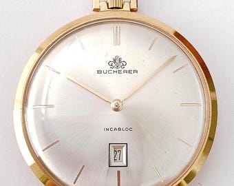 VIDEO* Reloj colgante vintage suizo "BUCHERER" ultradelgado chapado en oro de mediados de siglo, de la década de 1960, mecánico de cuerda manual.