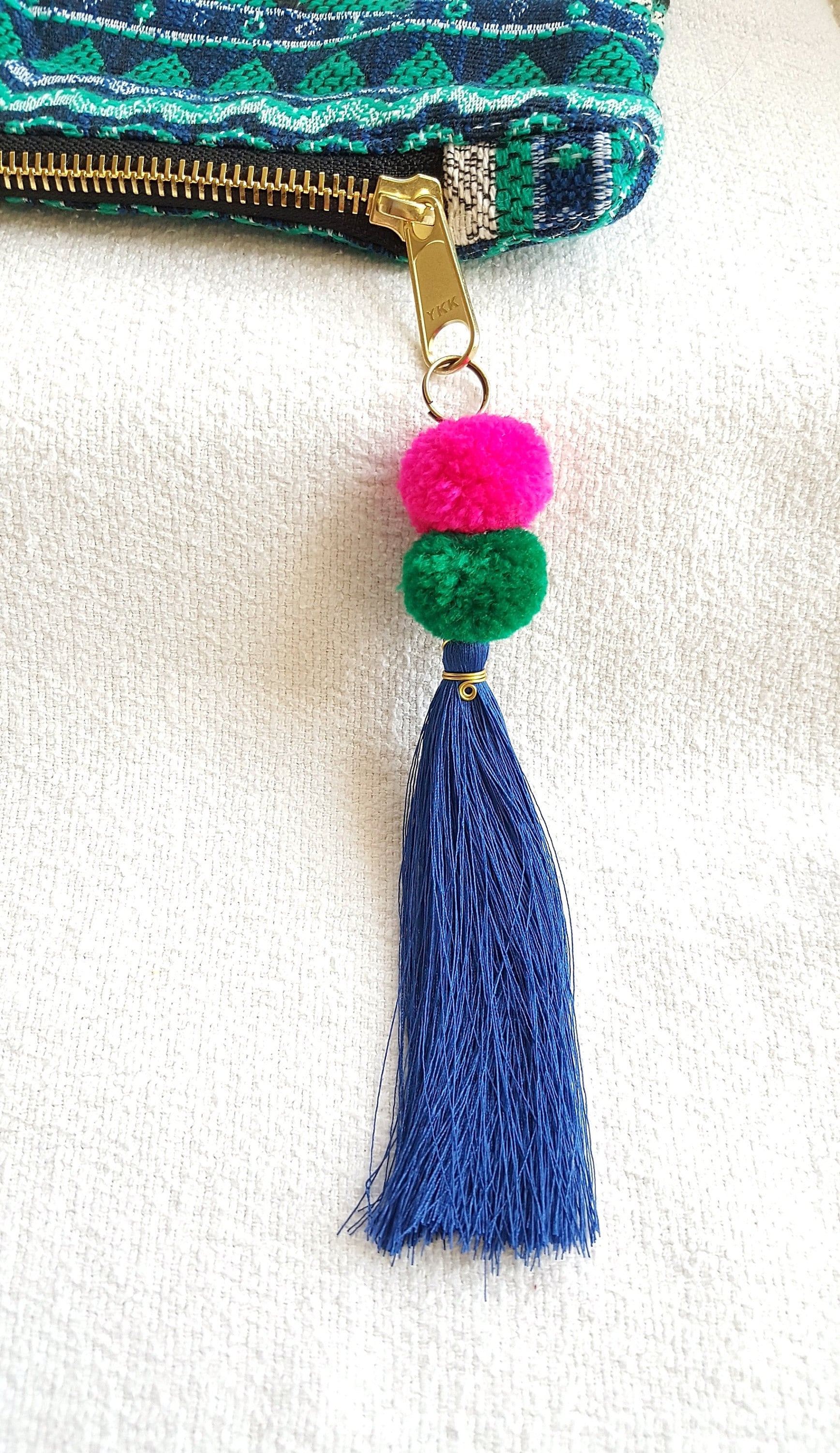 POLYGON CLUTCH WITH TASSEL DYNASTY DAYS