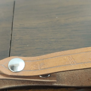Embossed genuine leather tankard strap with dragonfly motif