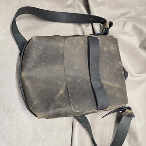Genuine leather messenger bag in dark green pull-up leather