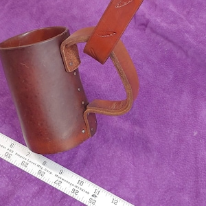 Embossed genuine leather tankard strap with feather motif