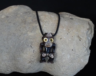 Hand carved  black and golden  Morher- of- pearl Polynesian TIKI 14k yellow gold pendant.