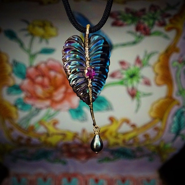 Carved black Iridescent Pinna Shell 14k yellow gold  Leaf   pendant  with genuine  purplish red sapphire , Tahitian keshi pearl .