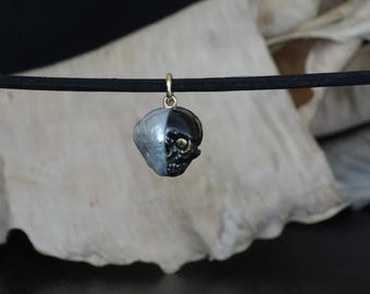 Skull in South Sea Pearl  carved  Black  Mother-of-pearl  14k yellow gold pendant , green Diamond.