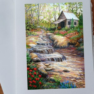 Geburtstagskarte Sommerlandschaft Landhaus Wasserfall Felsen und Bach ohne Text mit weißem Umschlag zu verschenken!
