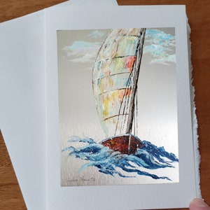 Sailboat card clouds waves breaking to the rhythm of the wind greeting card marine wishes with white envelope to offer