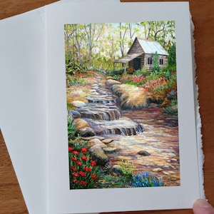 Carte anniversaire Paysage d'été chalet de campagne chute d'eau roches et ruisseau sans texte avec enveloppe blanche à offrir!