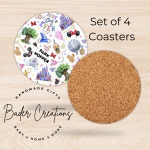 May include: Set of four white coasters with a colorful Disney park theme. The coasters feature images of Mickey Mouse, Cinderella's castle, and other park icons. The text "Best Day Ever" and "Park Hopper" are also included. The coasters are made of cork.